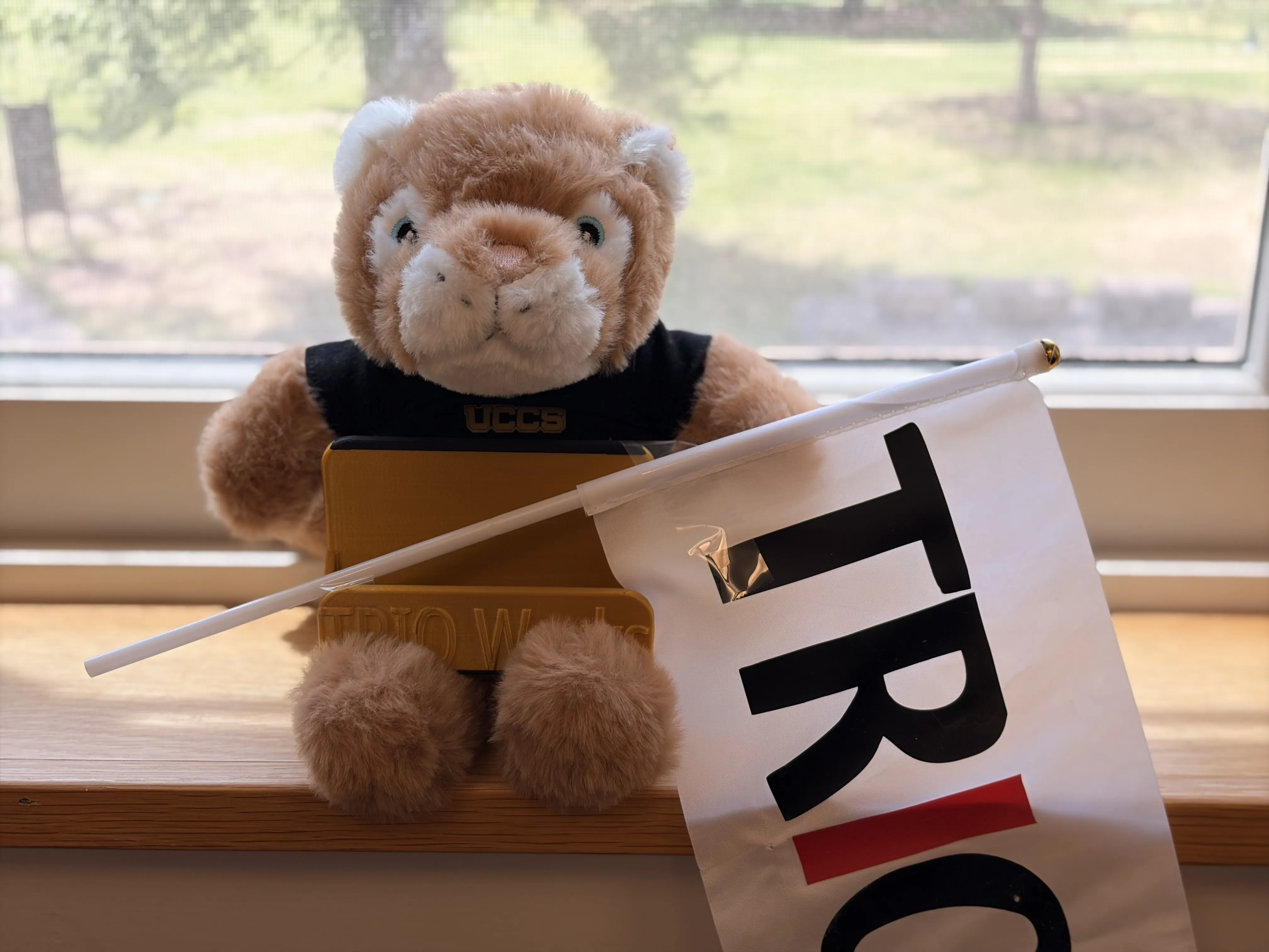 Clyde holding TRiO Flag